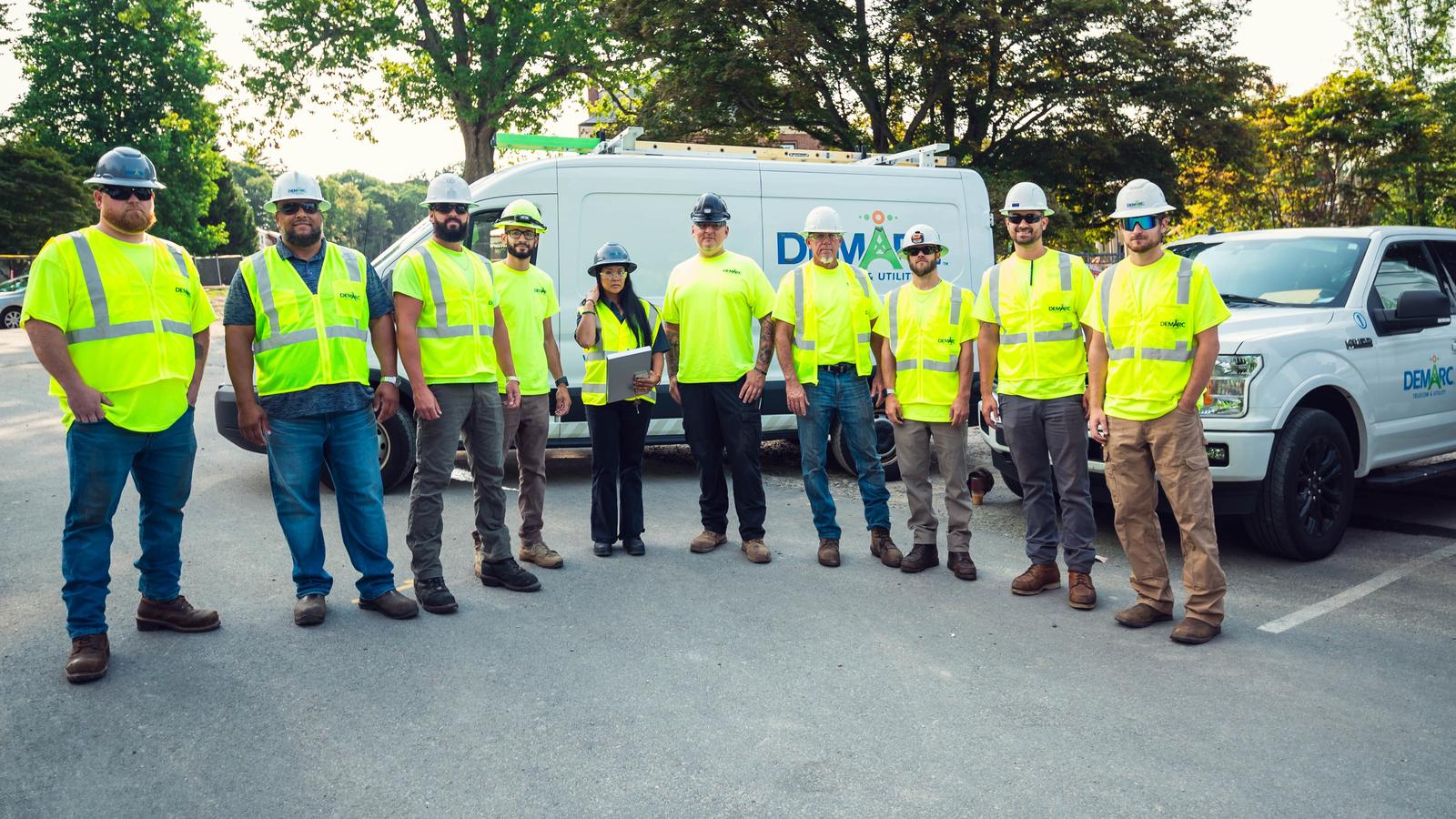 Demarc Telecom & Utility field crew with company vehicles in Massachusetts
